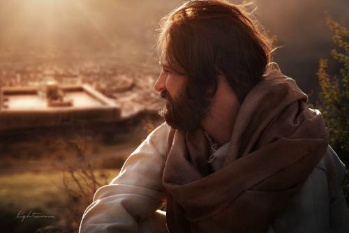 Photo of Jesus sitting on a hill looking down at Jerusalem.