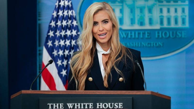 A women standing at a podium.