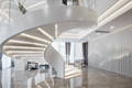 Photo of spiral staircase lit with LED strip lights, links to a blog post about powersupply calculator