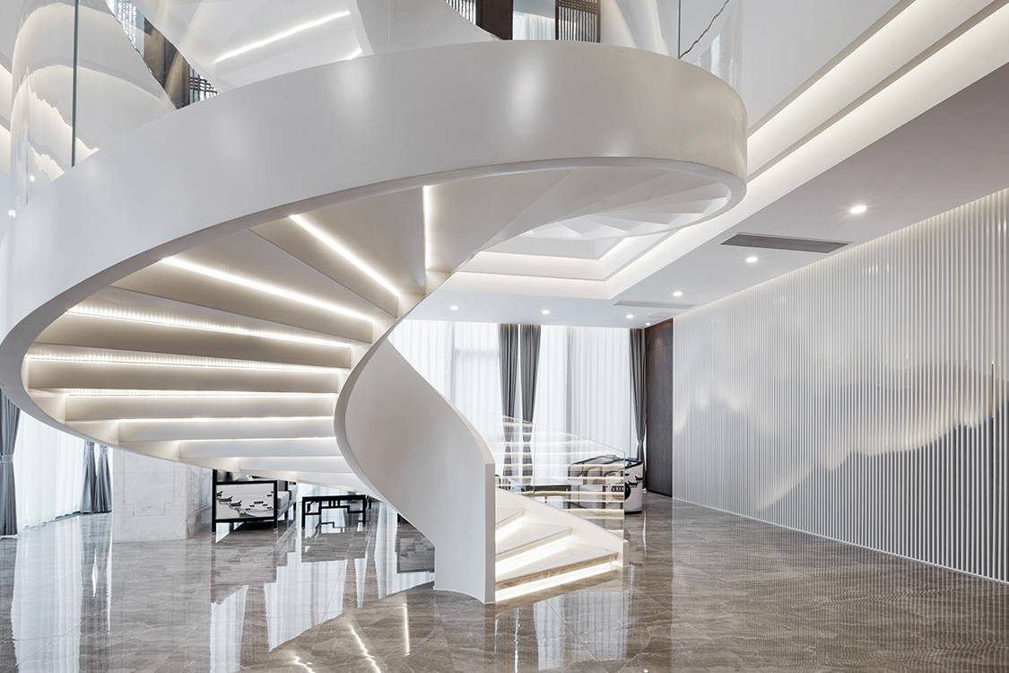 Photo of spiral staircase lit with LED strip lights, links to a blog post about powersupply calculator