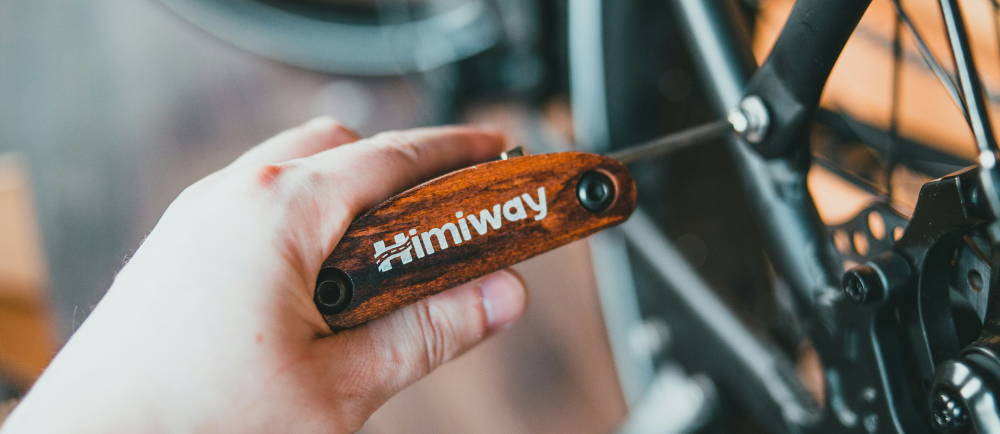 a himiway bike tool tightening a bolt on an electric bike