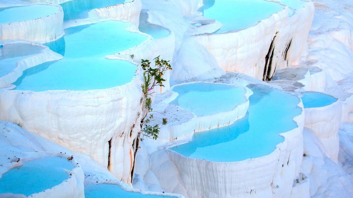 Pamukkale means cotton castle in Turkish, describing the terraces' snow-white appearance from calcium-rich thermal waters