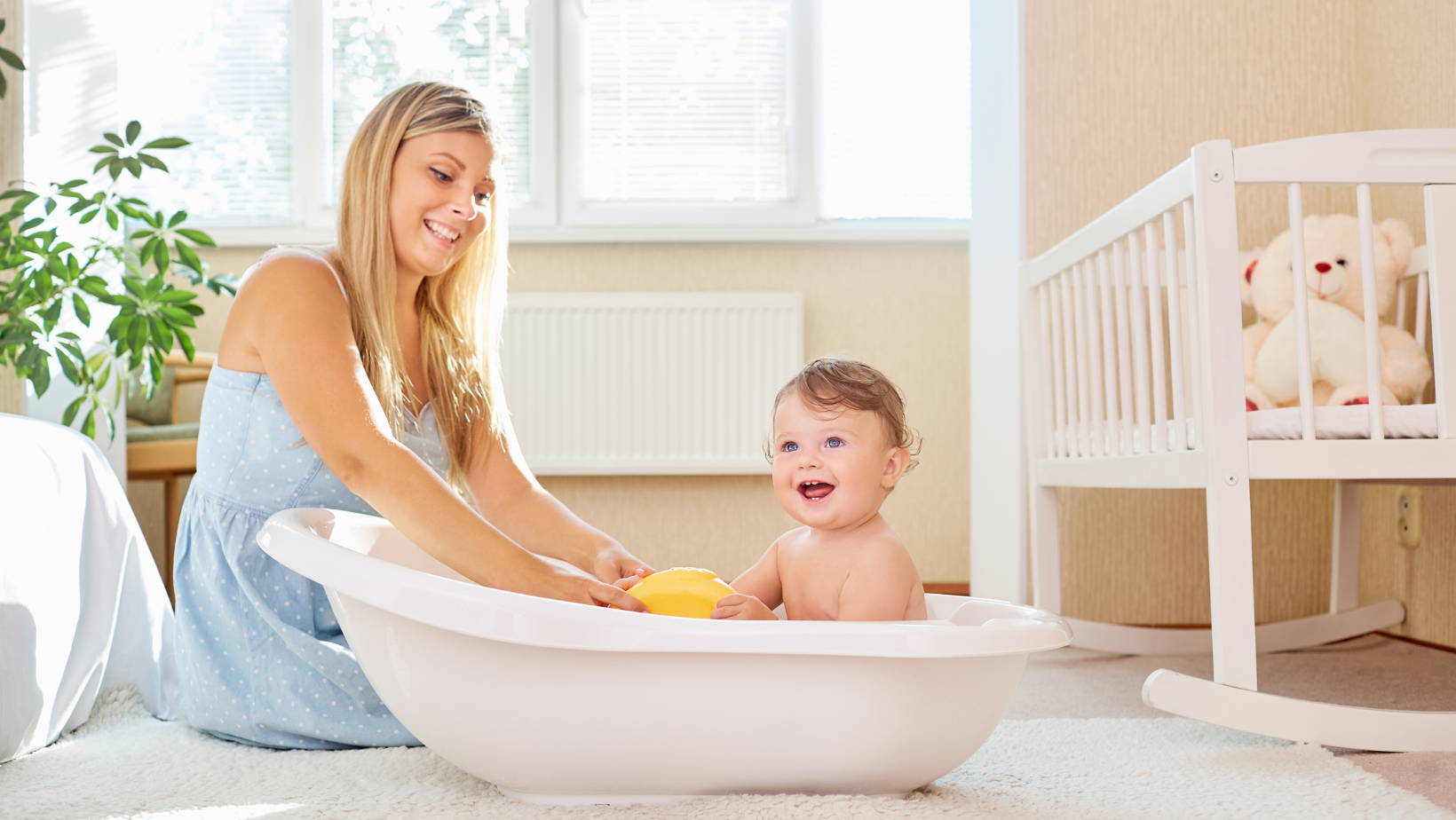 Mom bathing baby | My Organic Company