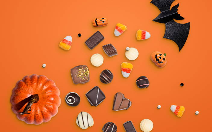 Assortment of chocolates and Halloween decorations (preview)
