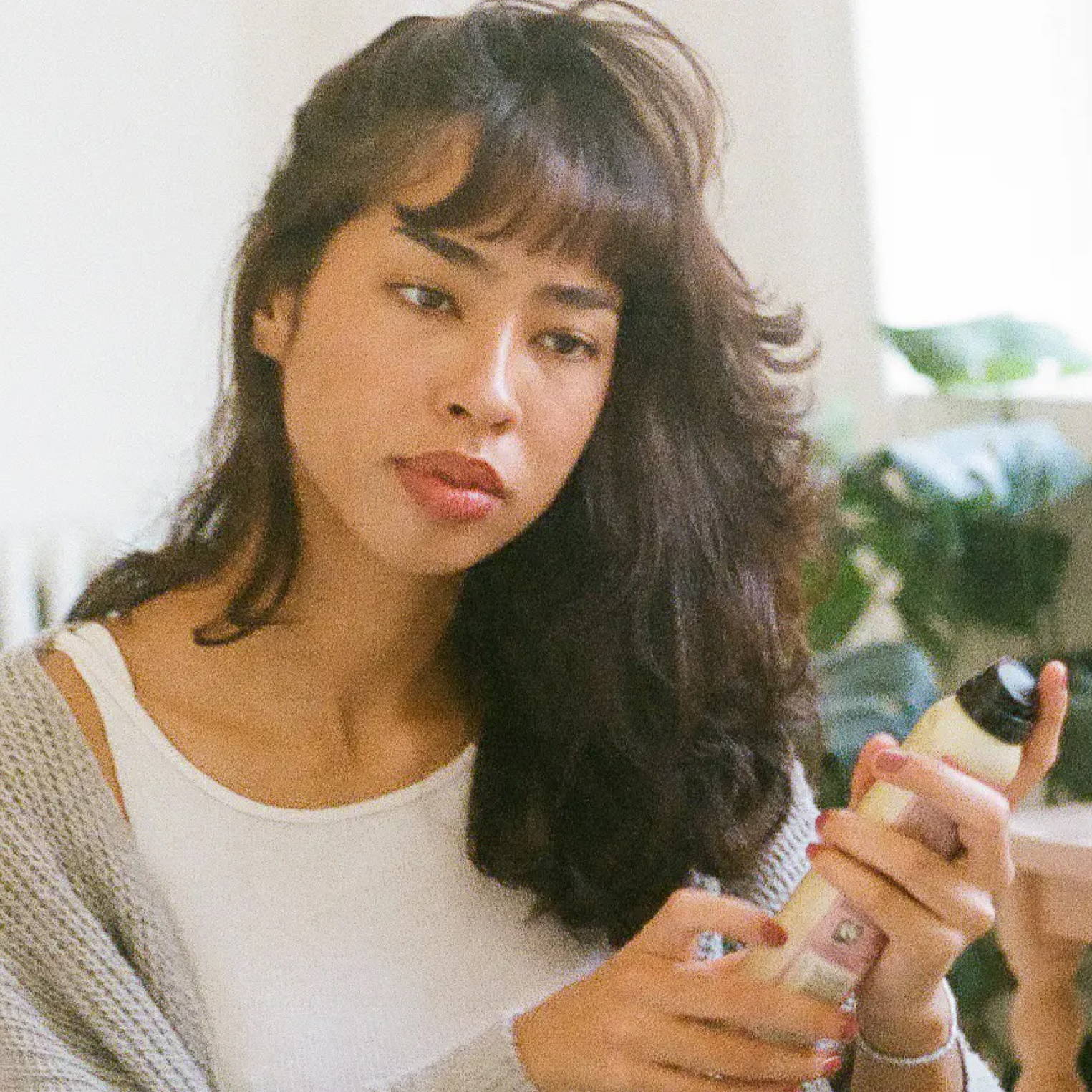 woman with wolf cut using Davines hair spray