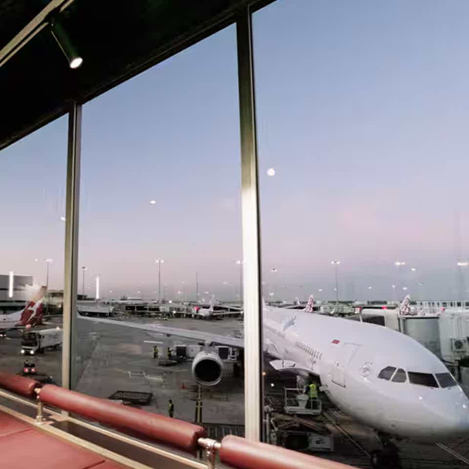 Cafe interior with aeroplane outside window at an airport