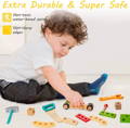 Little boy playing with a wooden car that he made with his Montessori Wooden Toolbox. 