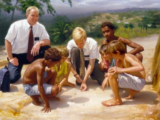 Two elder LDS missionaries play a game of marbles with local children.
