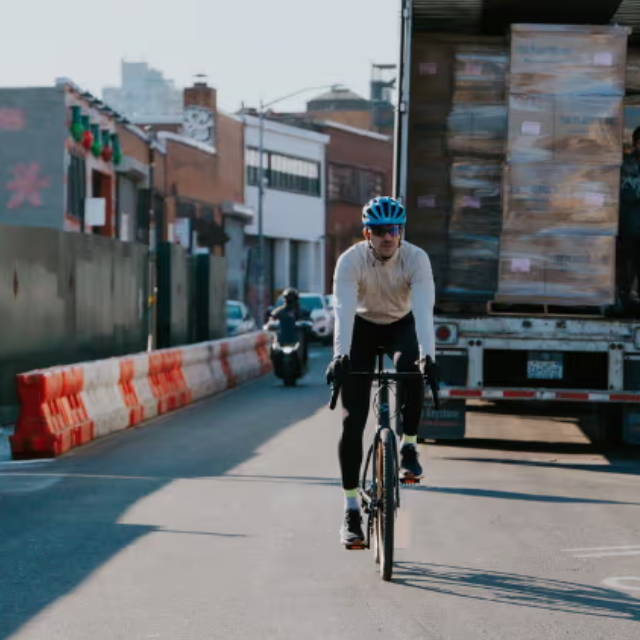 a man riding an electric road bike in a city