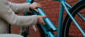 Rider removing ebike battery from Tenways bike