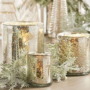 mercury glass candle holders with winter greenery