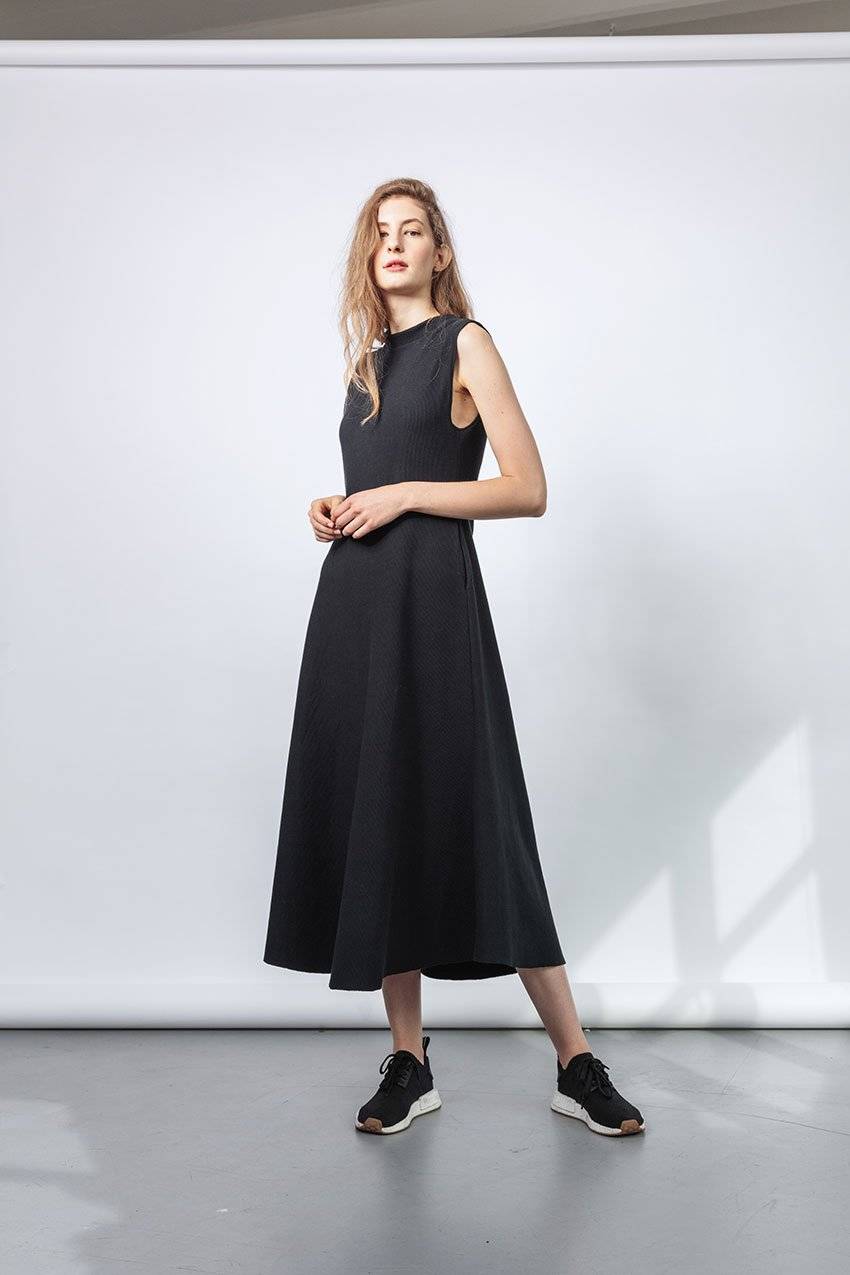 Woman wearing black organic cotton dress