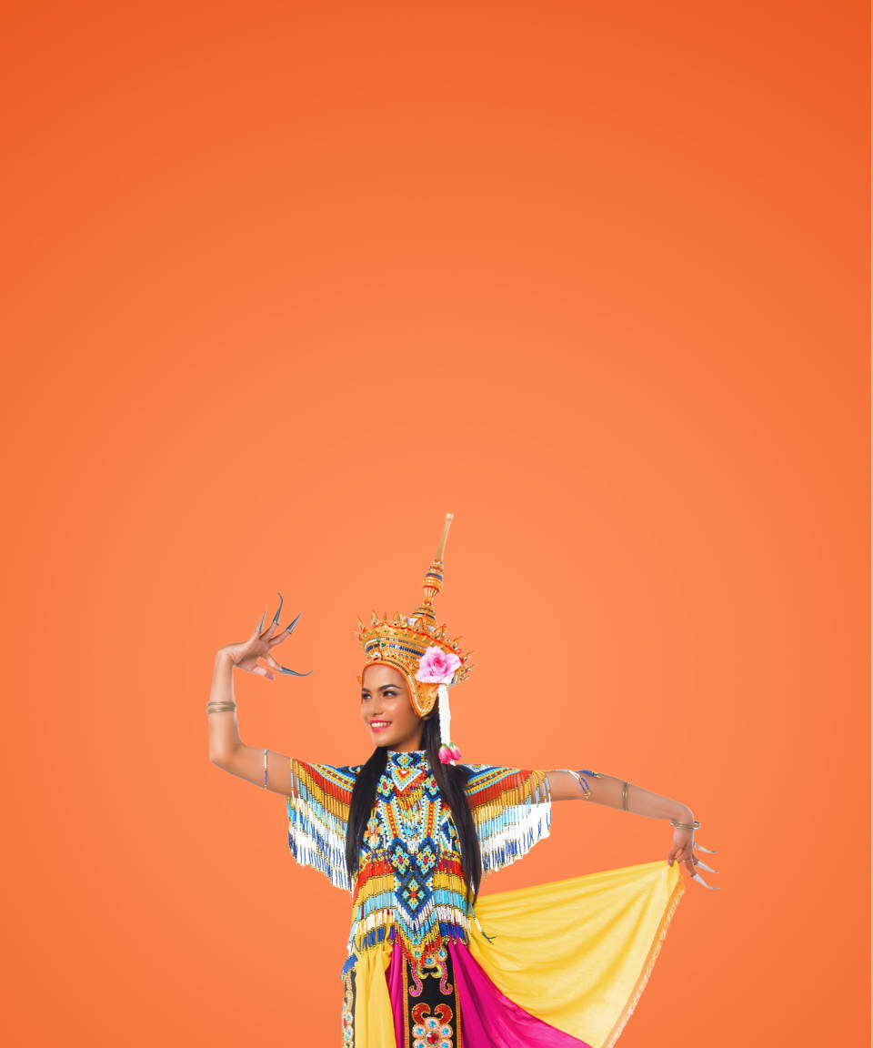 A South Asian dancer wearing a traditional headdress and outfit for Confetti's Virtual Asian Dance Class