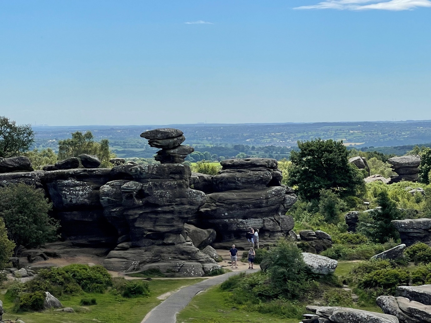 A picture containing rock, sky, outdoor, grass

Description automatically generated