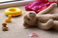 Stuffed animals and baby toys in a nursery play area