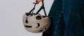 Woman holding MIPS bicycle helmet
