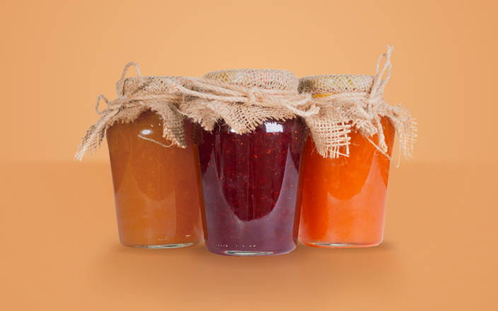 Three jars of jam tied with burlap and twine for Confetti's Virtual Jam Making Class