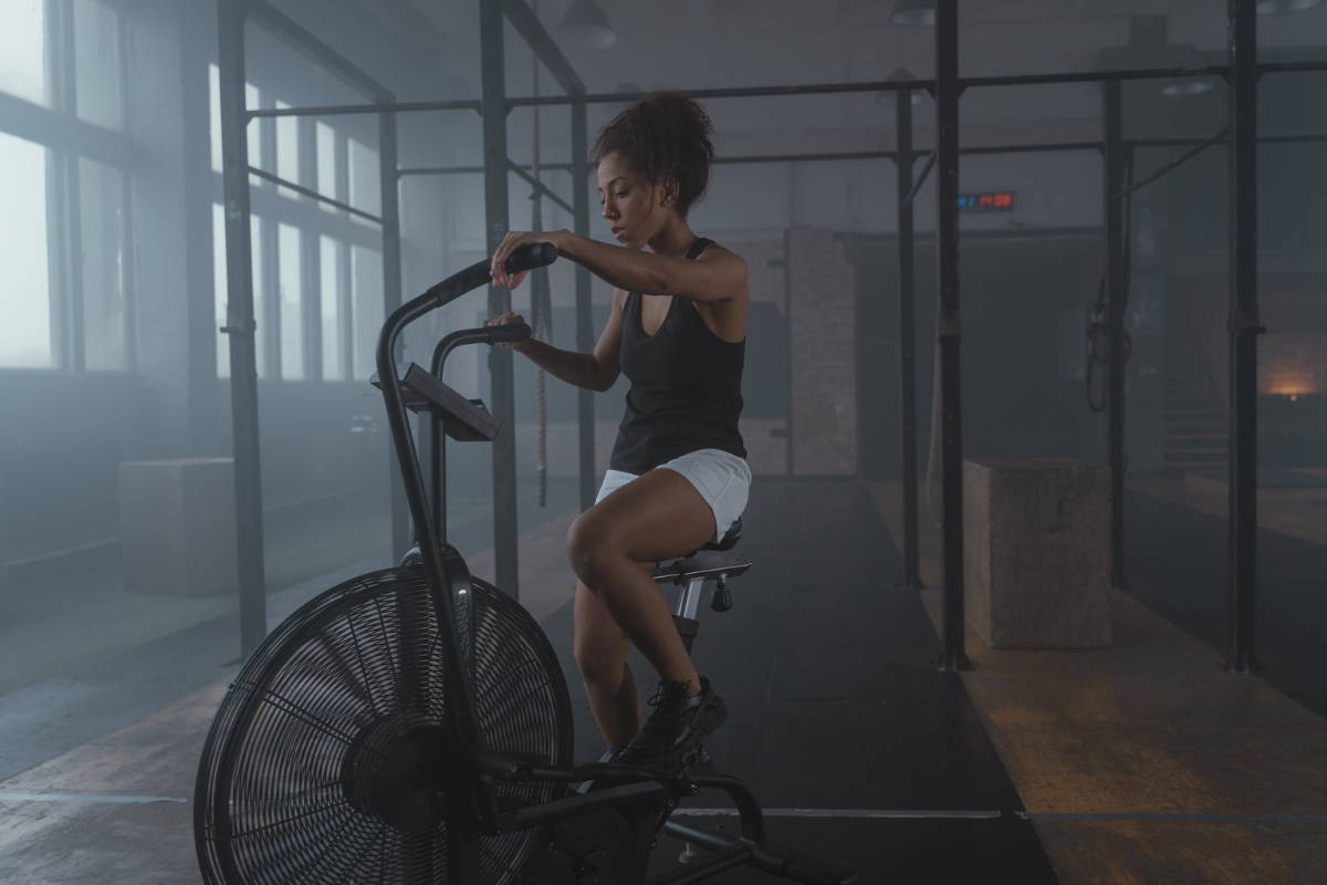athlete in gym on air bike