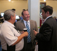 Brian Hamburger, center, confers with Daniel Bernstein, right, and Donald Rice, an RIA principal in Rep. Spencer Bachus' Alabama district.