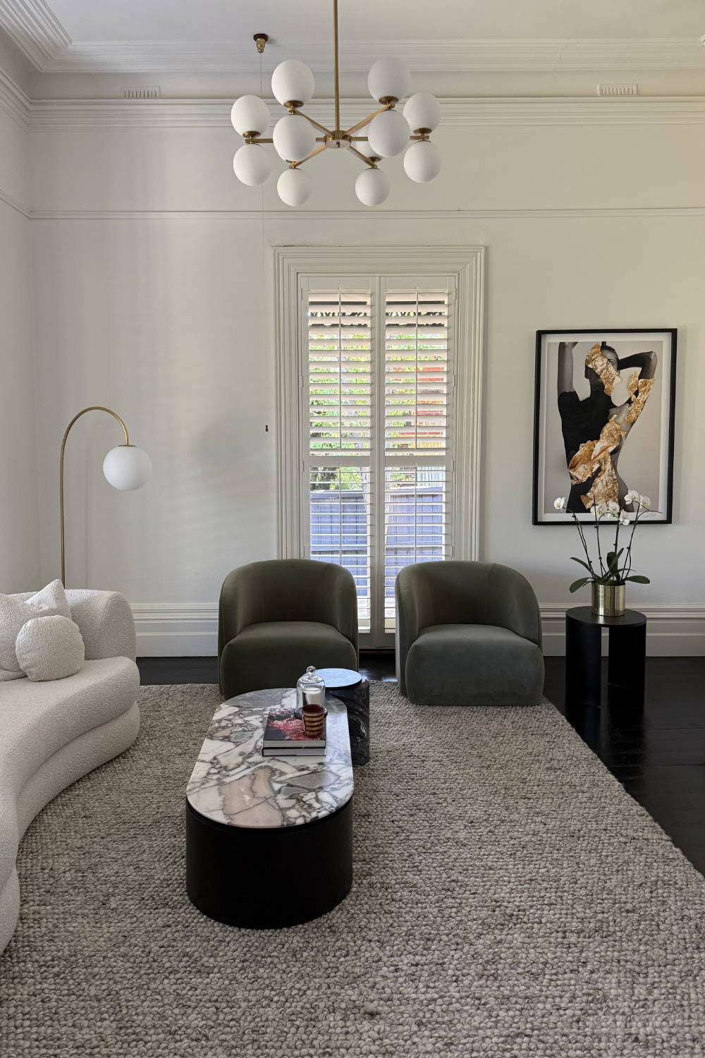 'Golden Girl (With Black Rose)' by Dina Broadhurst - An art print of a black and white figure embellished with gold leaf, framed and styled in a formal lounge setting