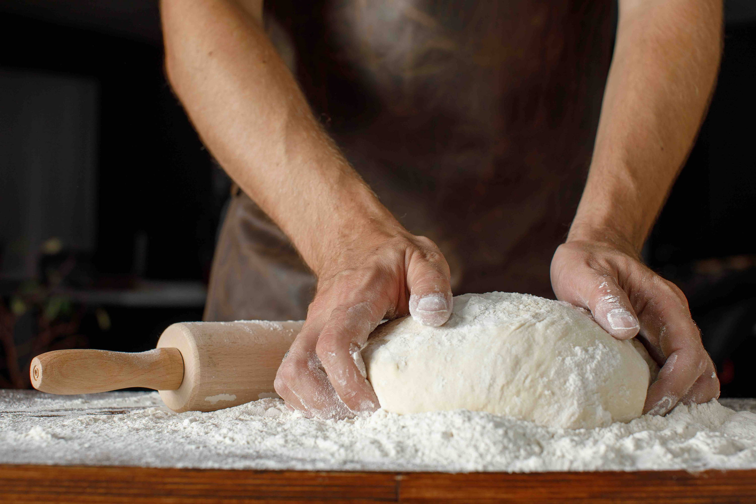 Hands making bread