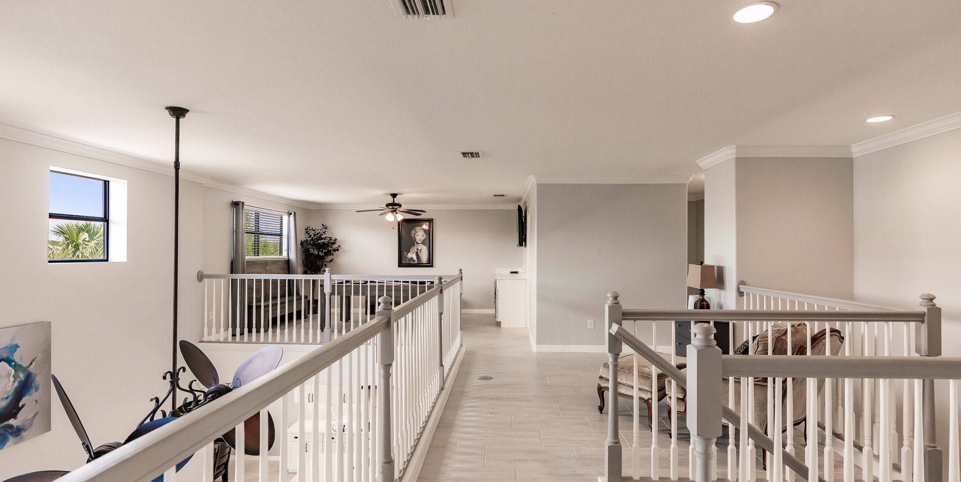 corridor with hardwood floors and natural light