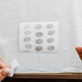 row of fingerprints on inkless fingerprint paper