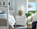 serene beachy bedroom with rattan lamp