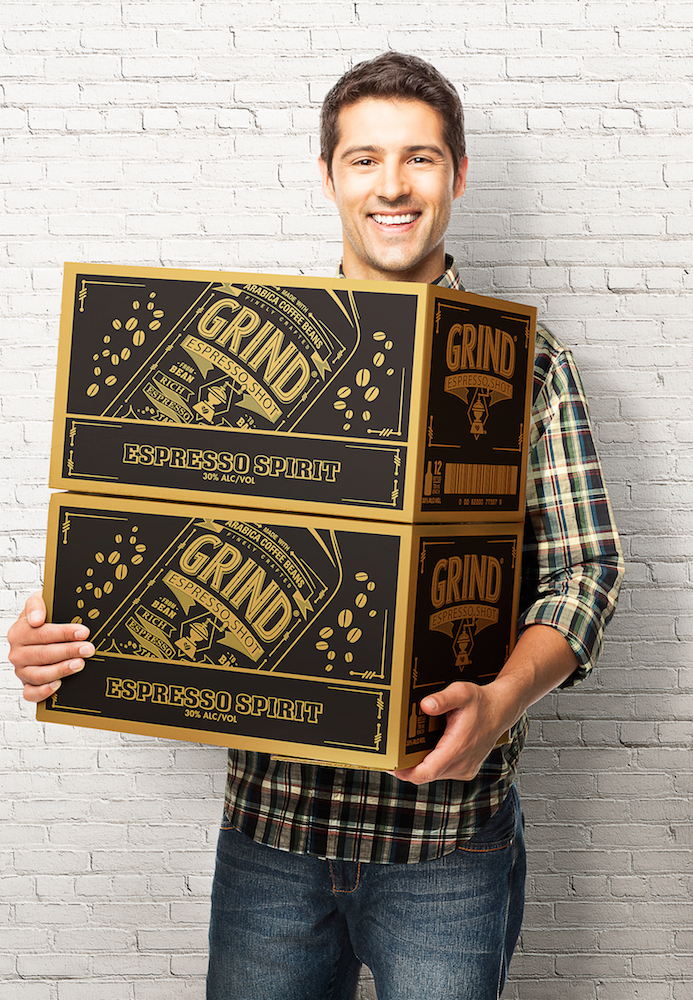 Happy Young Man Carrying a Cardboard Box - Isolated