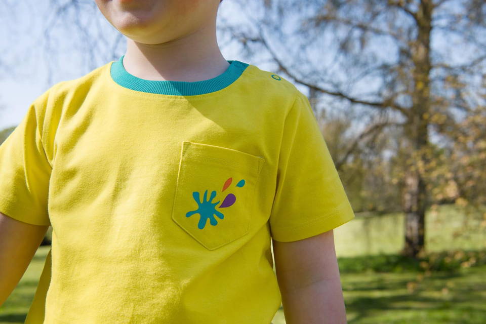 Image of a Ducky Zebra sweatshirt sleeve arm with an embroidered splash motif