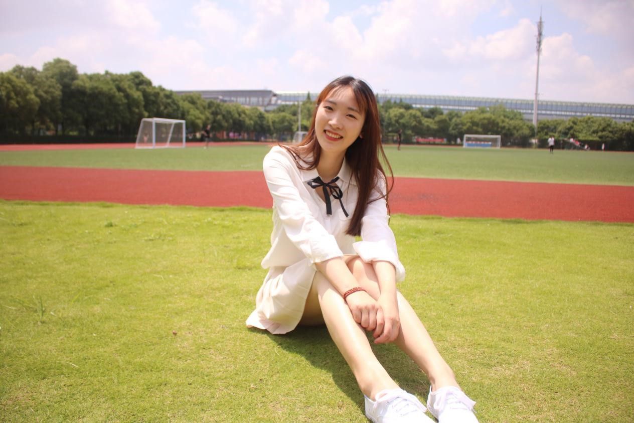 Zhao Xin sitting on some football pitches