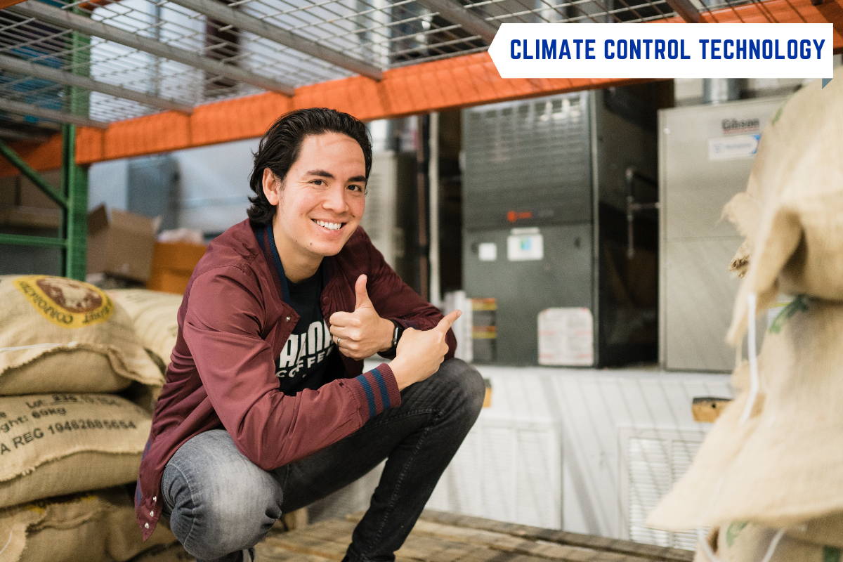 A man squatting beside our Climate Control machine