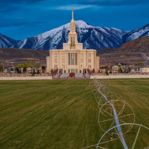 A green field stretched out in front of the Payon Utah Temple.