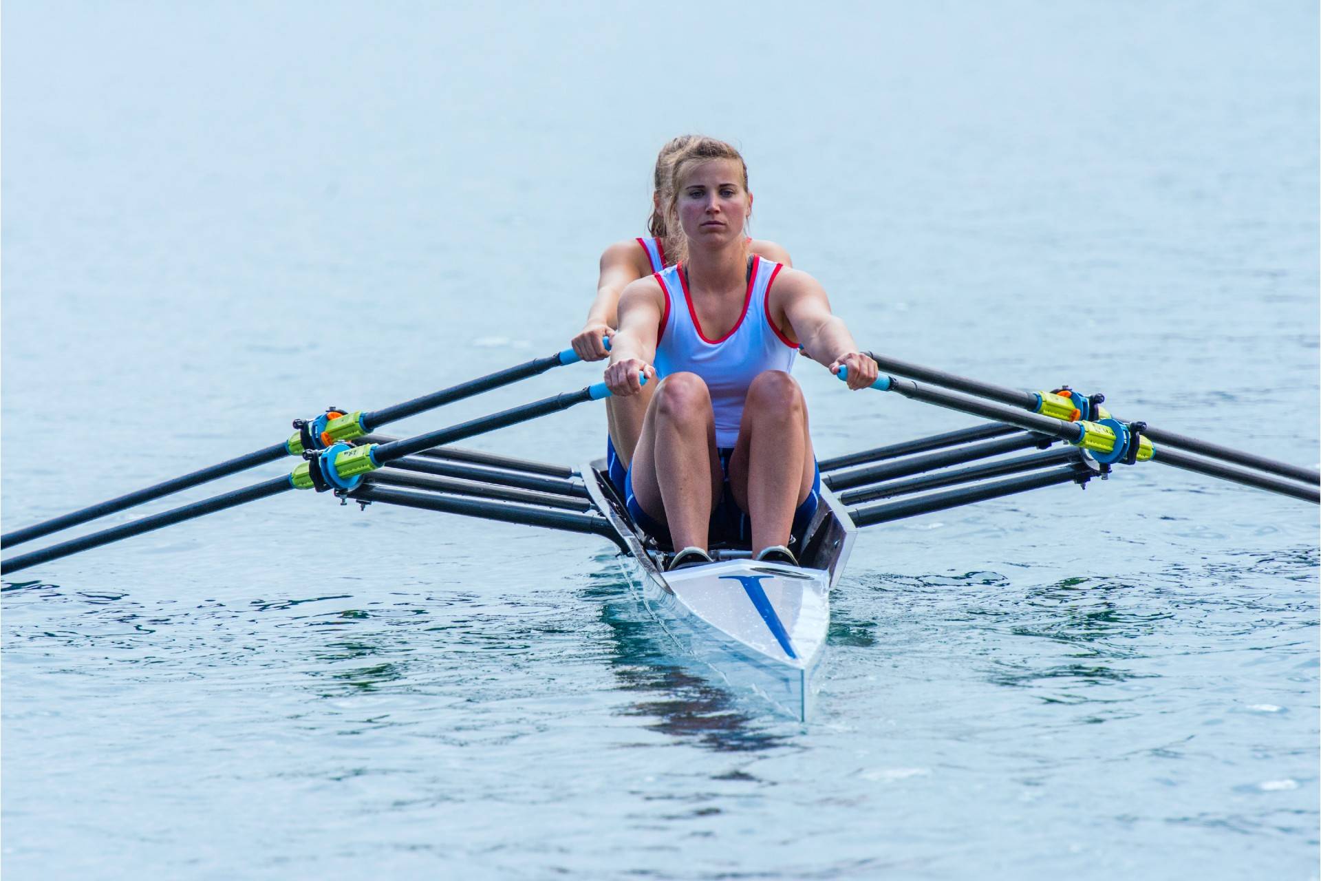 Woman team performing rowing