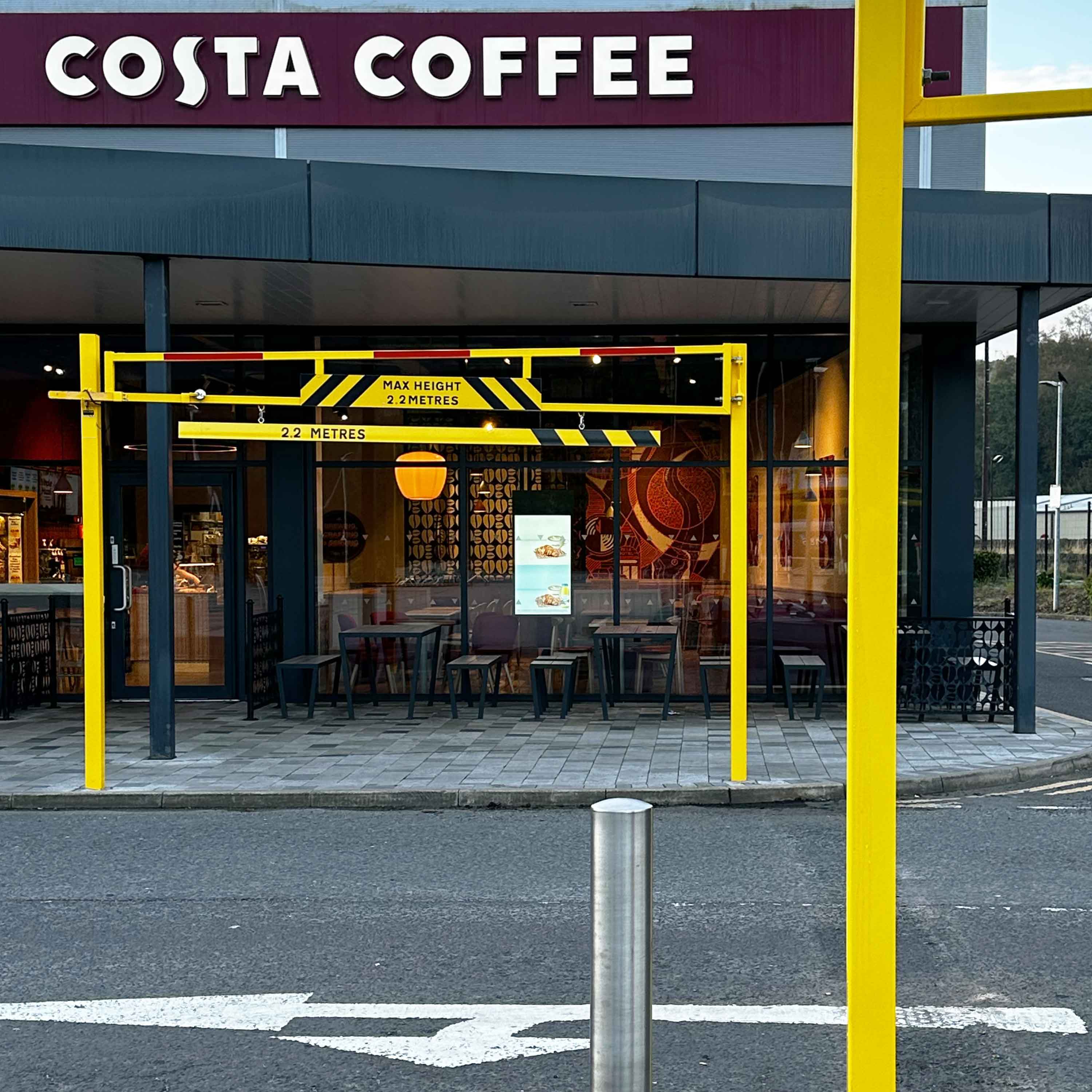 Street-Furniture-installation-service-UK-yellow-height-restriction-barrier-swing-gate-concrete-fixed