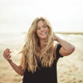 Image of wavy hair women on beach