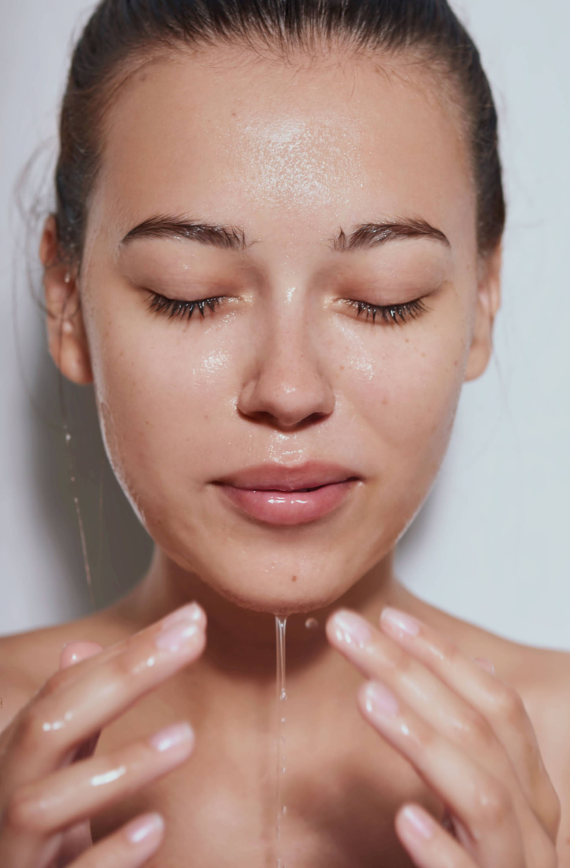 Woman rinsing her face