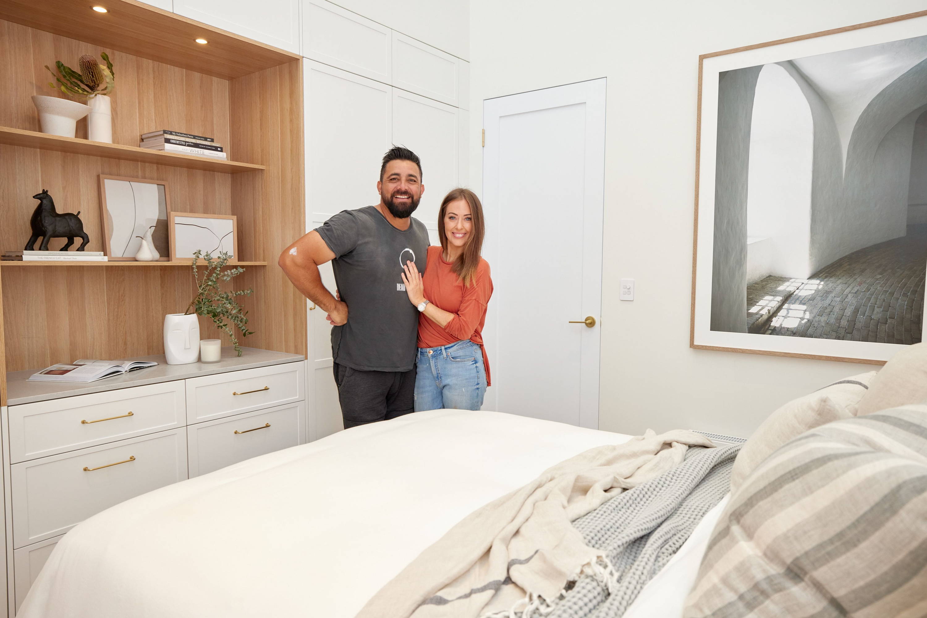 Ronnie and Georgia on The Block in their Guest Bedroom - A neutral bedroom interior with the two contestants in situ