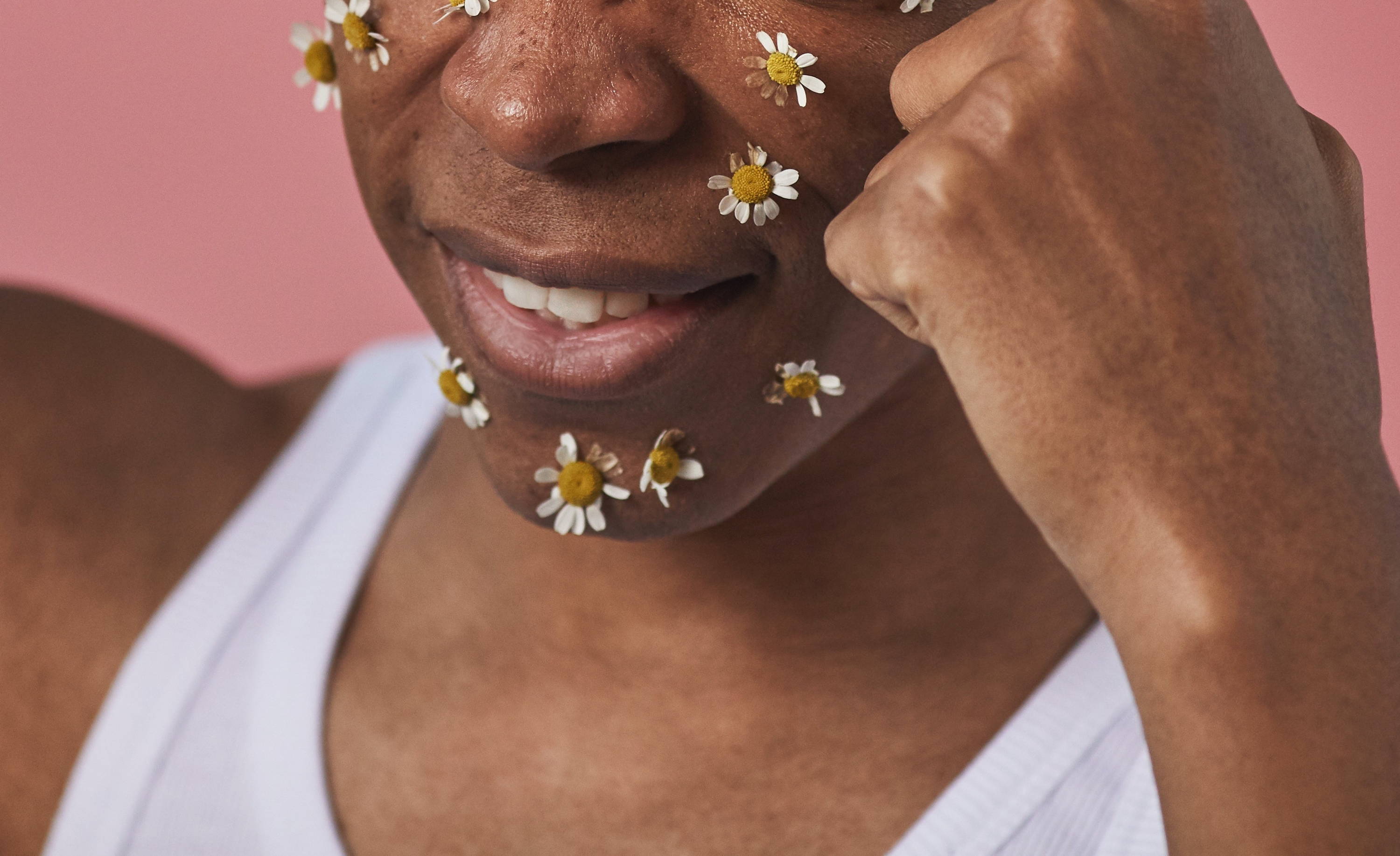 Woman with flowers on face