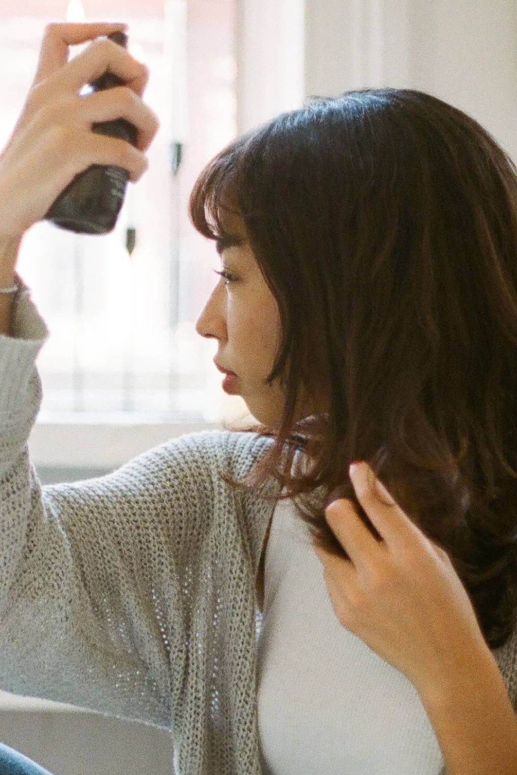 woman using Davines OI Oil