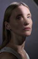 model with glowing skin looking at the camera