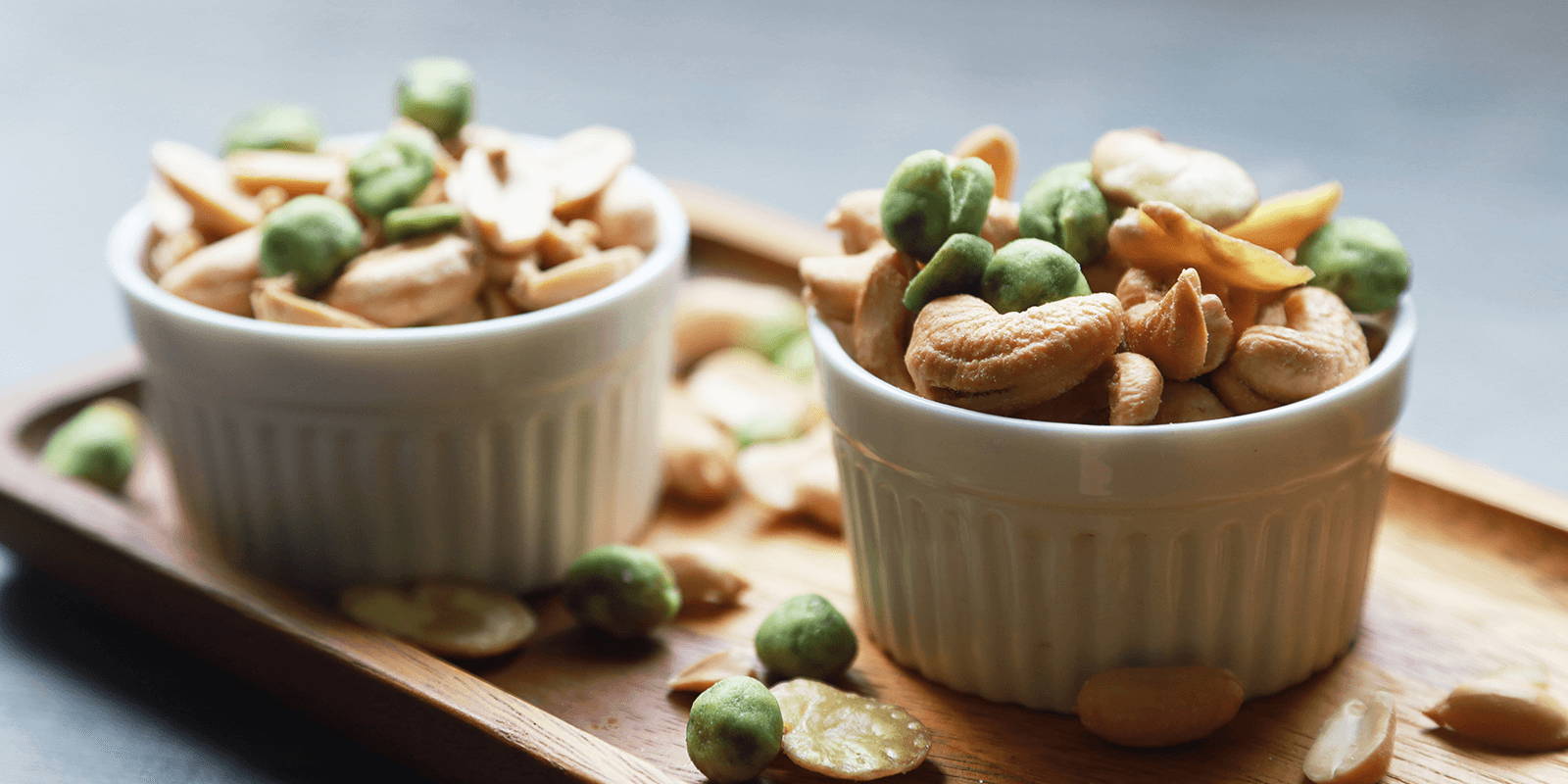 Two bowls of mixed nuts.