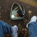purse-on-ground-at-womans-feet