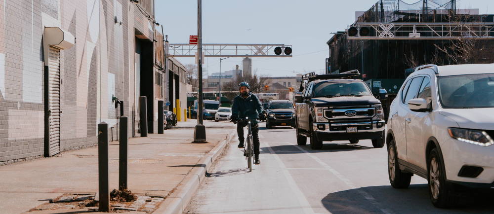 New York City commuter with electric bike in bike lane