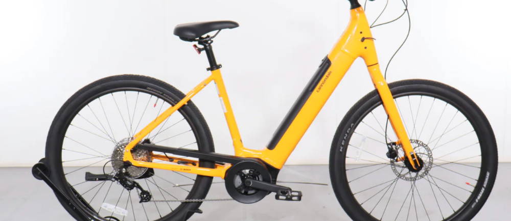 a yellow Cannondale Adventure Neo 4 electric step-through bike