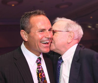 Ron Carson keeps his friends close and his fellow alpha dogs --Warren Buffet, right -- closer.