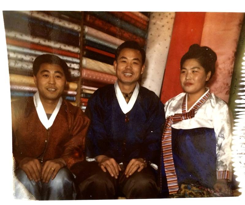 FAMILY OF 3 IN HANBOK DRESSES. 