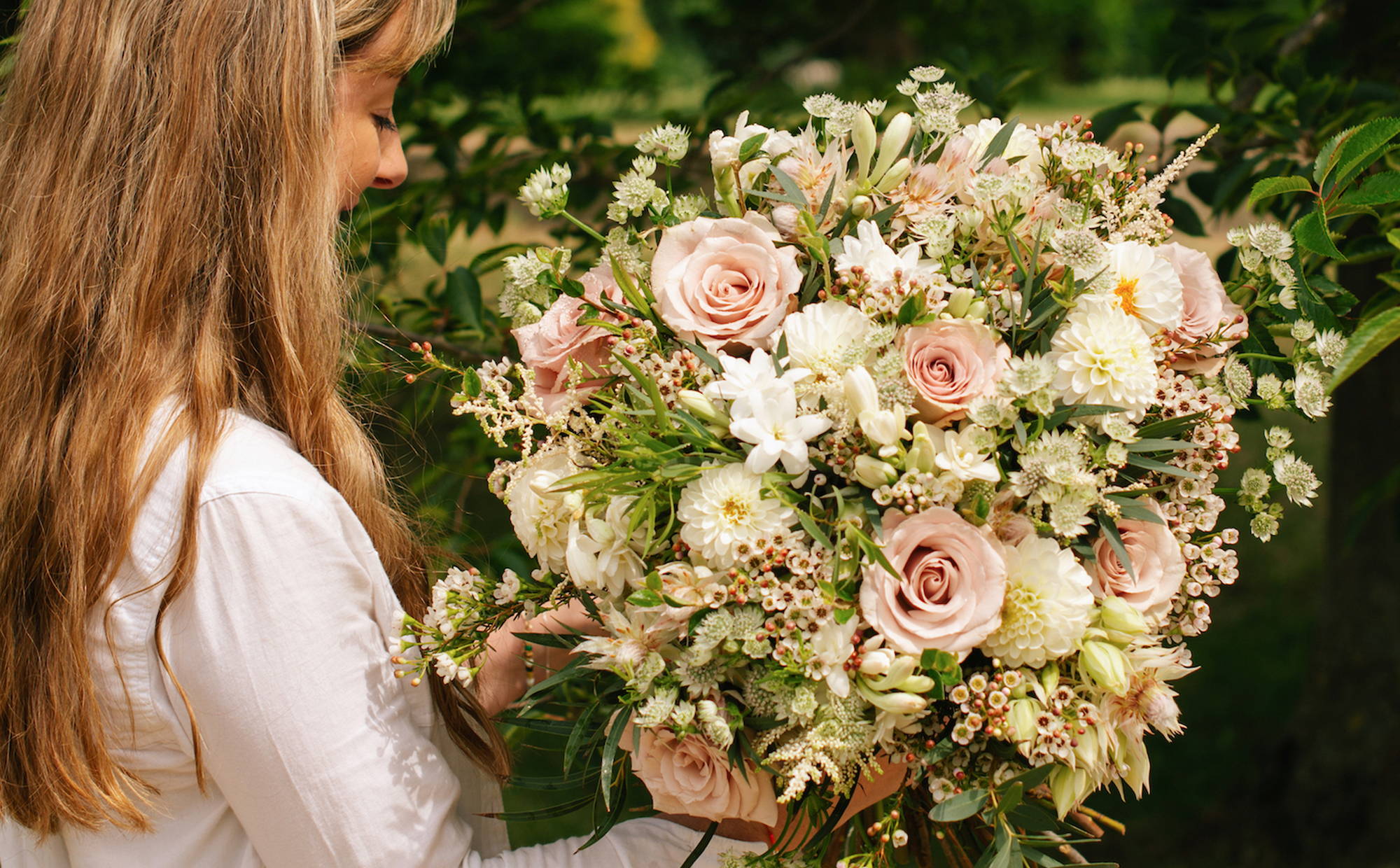 Wild at Heart Summer Garden Delights Bouquet, featuring white dahlias, tuberose and quicksand roses.