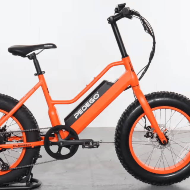 An orange Pedego electric bike