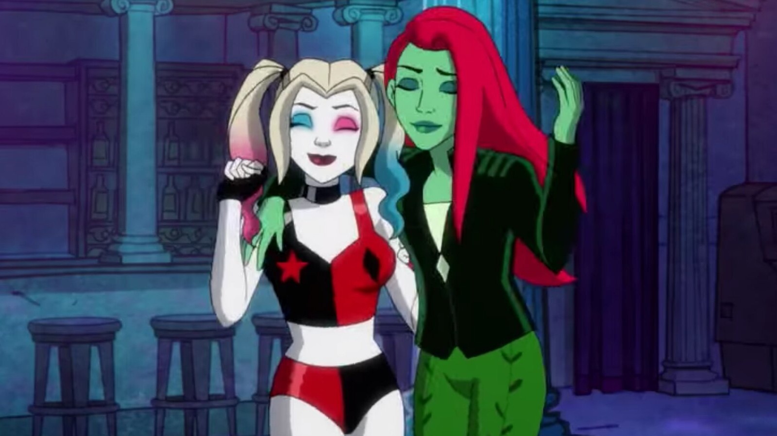 Harley and Poison Ivy hanging onto eachother smiling with their eyes closed.